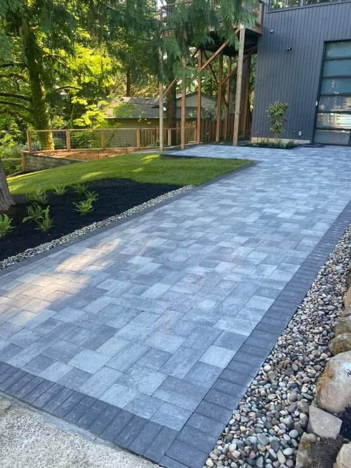 New stone walkway connected to a residential landscape