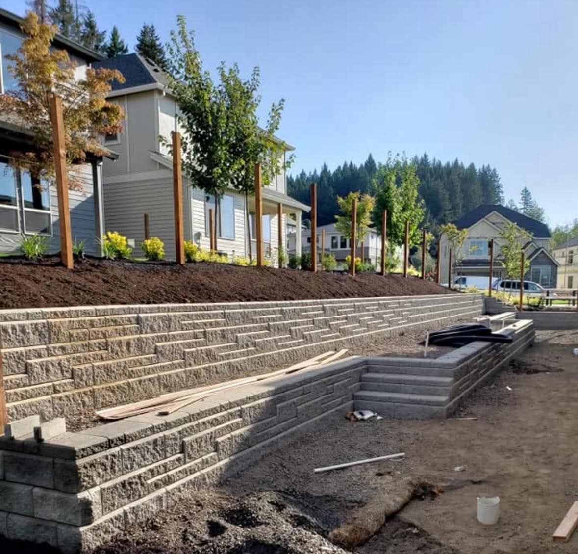 Terraced block retaining walls along a landscaped residential slope